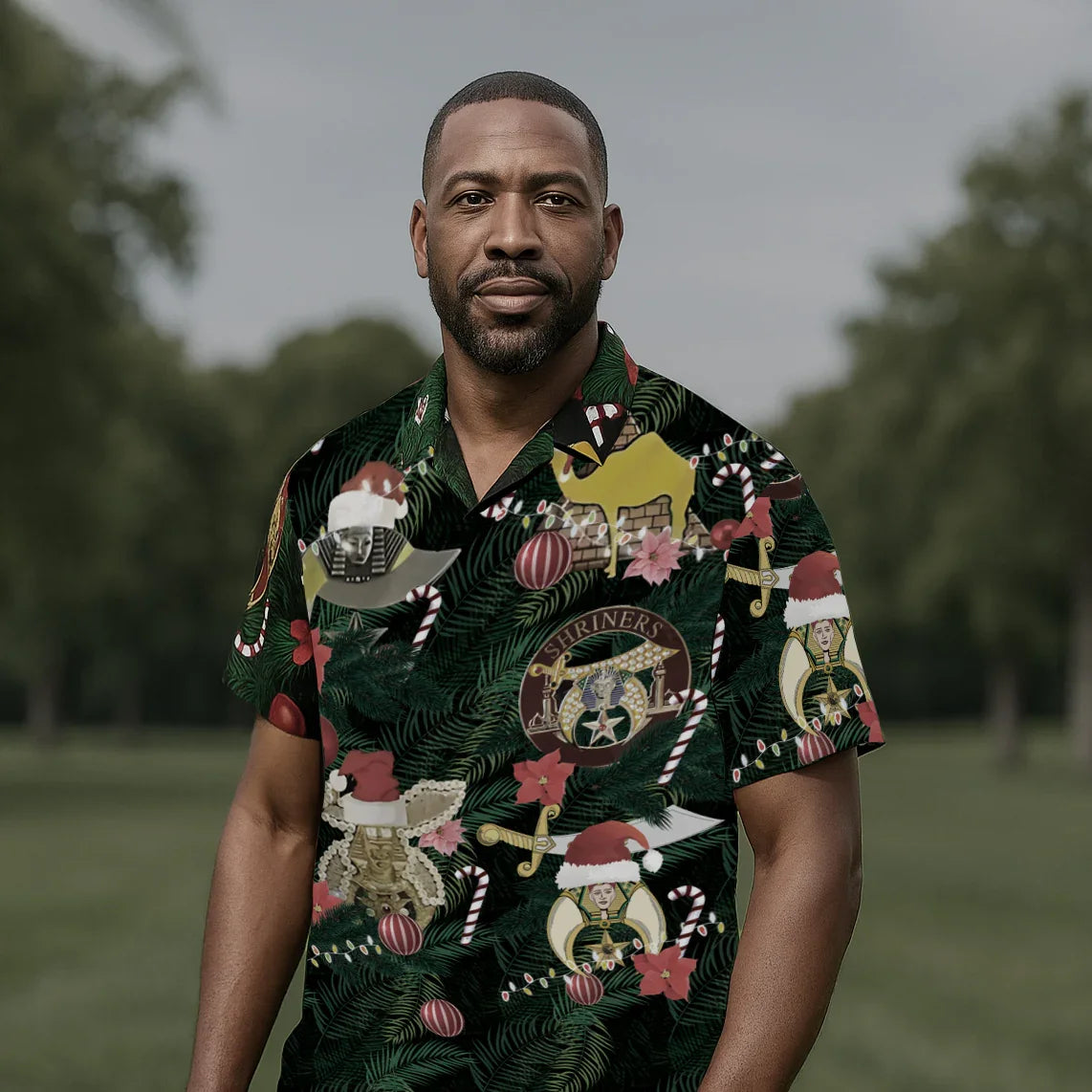 Man wearing a festive patterned shirt outdoors with trees in the background
